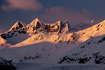 The Mendenhall Towers, part of the beautiful Coast Mountain Range of Southeast Alaska and one of Juneau's most distinct landmarks, shines in the late afternoon winter light.