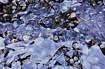 Another image taken near the shores of Mendenhall Lake featuring pebbles and the geometric patterns of ice.