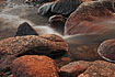 The second in a series of three images taken taken close up from a small stream running on to a Juneau beach.