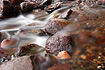 The third in a series of three images taken close up from a small stream running onto a Juneau beach.